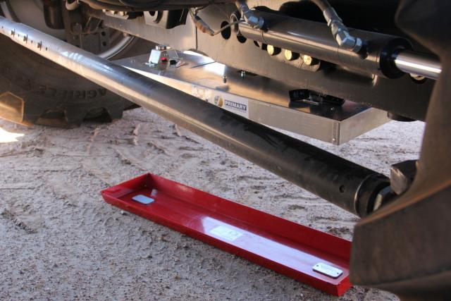 Photograph of a drop tray under the harvester rear axle to measure machine grain losses