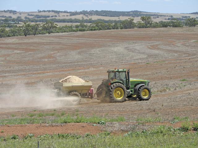 Spreading lime with a tow behind spreader South of Northam.