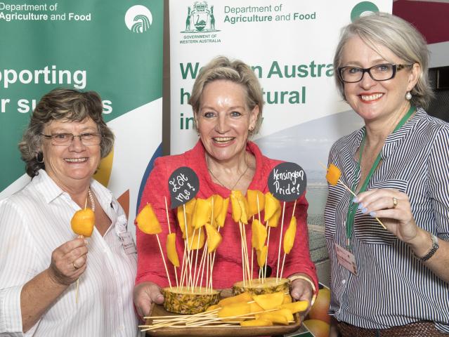 New Western Australian Agriculture and Food Minister, Alannah MacTiernan (centre), with Maureen Dobra, Loose Leaf Lettuce Company (left) and Sue Middleton, Moora Citrus, sample some fine local mangoes at the inaugural State Horticulture Update.
