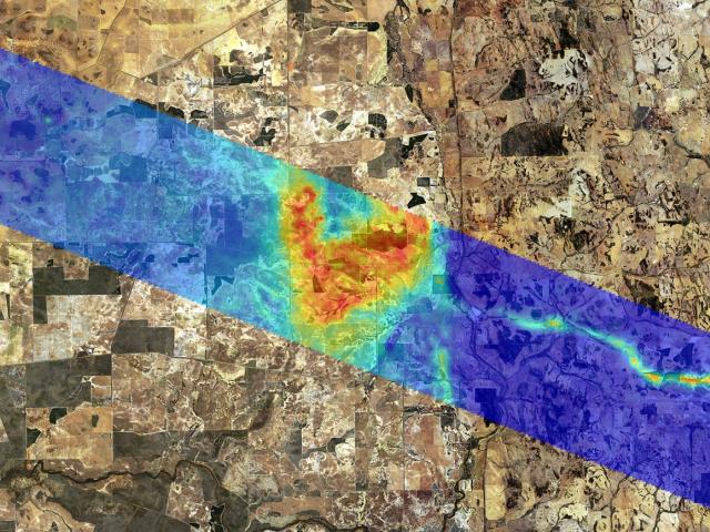 Airborne electromagnetic data presented as a colour coded image which shows a palaeochannel (ancient river) in the right hand side, sitting among granite