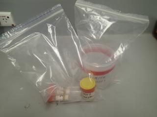 sampling pots sealed with red electrical tape inside ziplock bags