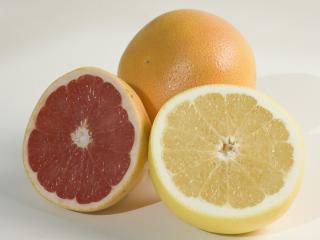 Whole orange and cut grapefruit.