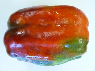 Cucumber mosaic virus infected capsicum fruit with uneven colour and ripening