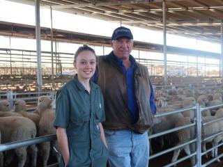 Two vets standing in a saleyard